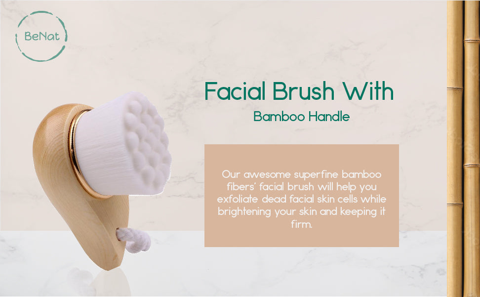 Facial brush with bamboo handle on a light background