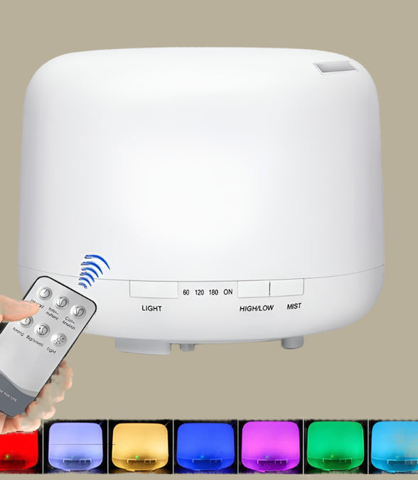 White humidifier with remote control and color-changing lights on a white background