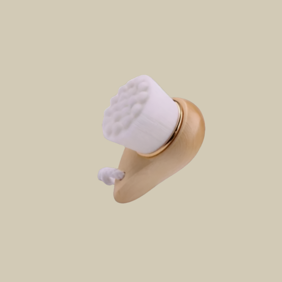 White silicone face brush with wooden handle on a white background