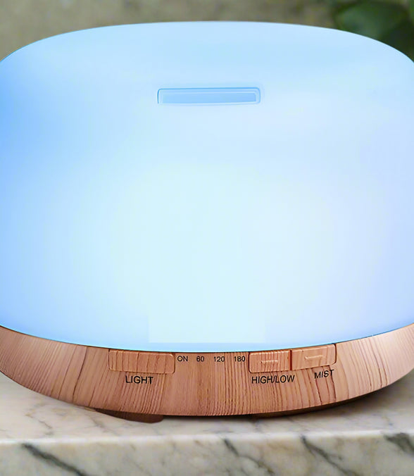 Blue and wooden diffuser on a white background